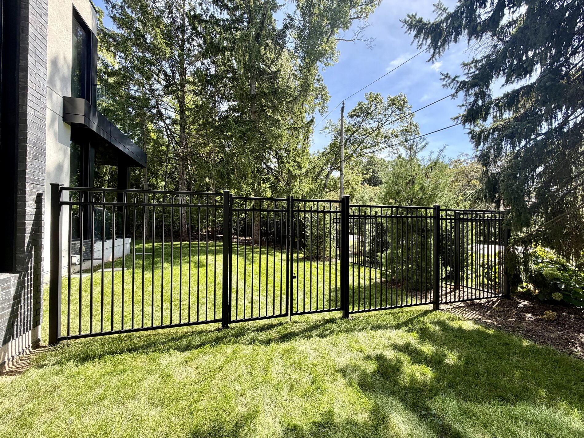 1654 Birchwood Drive — completed metal-fenced privacy yard